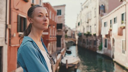 Fototapeta na wymiar Young female tourist walking in Venice