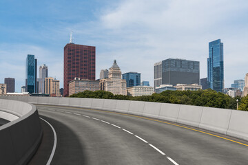 Empty urban asphalt road exterior with city buildings background. New modern highway concrete construction. Concept of way to success. Transportation logistic industry fast delivery. Chicago. USA.