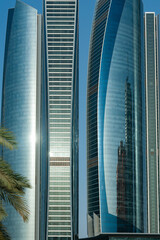 Close-up architectural detail of modern glass fronted office and business property Etihad Towers, Corniche Road, Abu Dhabi, United Arab Emirates. .