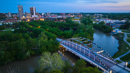 Aerial Martin Luther King Bridge at dusk with city lights and river