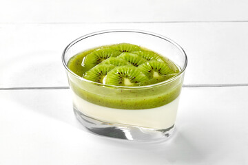 Panna cotta with kiwi and mint coulis and sweet berries