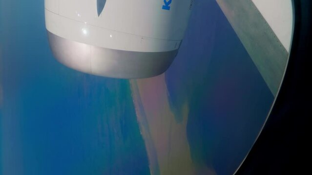 Flight over Greenland. Pollution of the oceans. Streams of dirt and sewage in the water of the sea. View from the airplane window to the planet earth. 
Greenland from an airplane.
