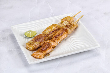 Grilled salmon skewer with sauce