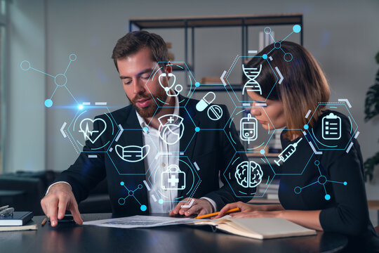 Businesspeople in formal wear taking notes signing contract at office workplace. Concept of important working moments, document sign, working process, concentration. Medical icons hologram - Powered by Adobe