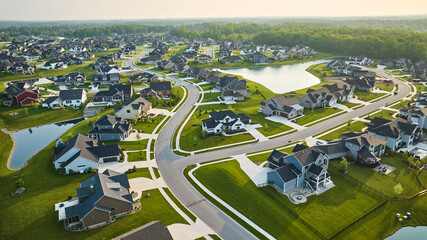 Large expensive homes in grand neighborhood with large ponds million-dollar high-end houses aerial