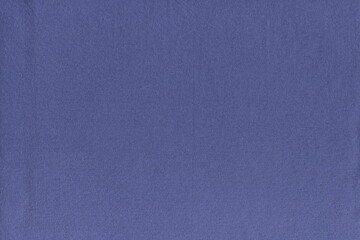 The texture of a soft natural cotton fabric of blue color in . Soft knitted napkin. home textiles. Dust rag. The usual simple background of pure natural fabric.