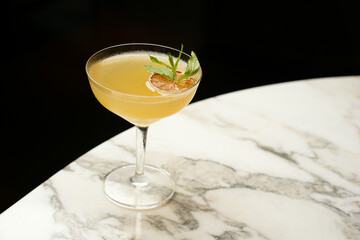 Fresh cocktail glass on a marble bar table