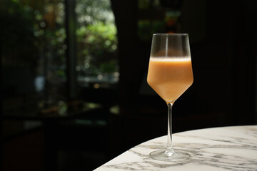 Fresh cocktail glass on a marble bar table
