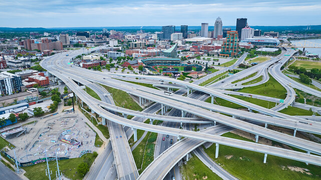 Crisscrossing suspended highway roads aerial Lynn Family Stadium downtown Louisville KY aerial