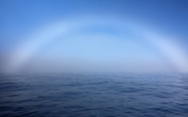A fogbow over Arctic Ocean near North Cape in Northern Norway on late summer day in August 2022.
