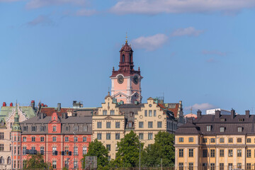 Obraz premium The church Storkyrkan and old houses in the island Gamla Stan, a sunny summer day in Stockholm