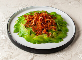 Stir-fried Cold Melon Slices with Cherry Blossom Shrimp served dish isolated on background top view of hong kong chinese food