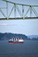 A freighter is anchored near the bridge to Astoria Oregon