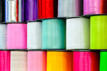 a set of coils  shiny ribbons in different colors for the label or decoration close-up as a texture background