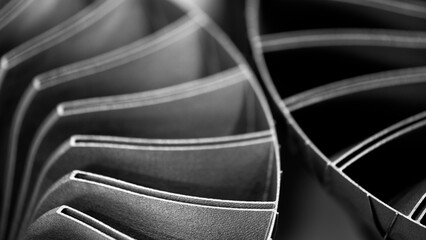Obraz premium Steel blades of turbine propeller 3D printing. Close-up view. Selected focus on foreground, industrial additive technologies concept