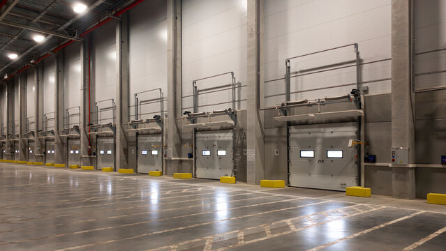 truck at loading ramps of a warehouse. Delivery logistics concept background