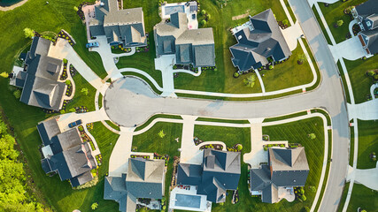 Downward view cul-de-sac large rich homes with pool and landscaping aerial several houses