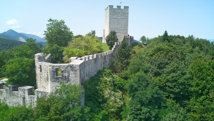 Fototapeta na wymiar Celje Old castle (Celjski Stari grad), aerial view of medieval fortification and town of Celje in Lasko valley in Julian Alps mountains, Slovenia, Styria.