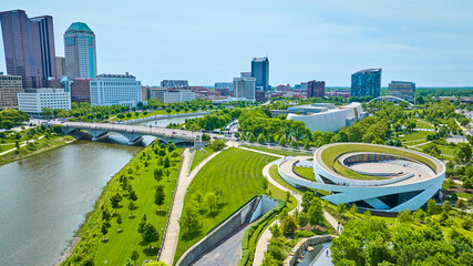 Wide view aerial National Veterans Memorial and Museum with Columbus Ohio skyline - obrazy, fototapety, plakaty
