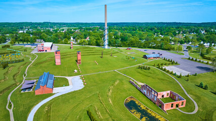 Ariel Foundation Park wide shot of destroyed factory buildings and walking paths aerial