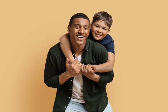 Happy Black Man Have Fun With Cute Child Preteen Boy