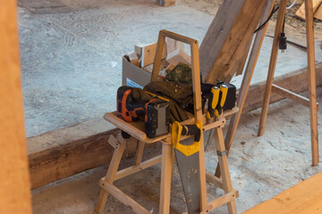 the carpenter's tool is tidied up on a special wooden shelf