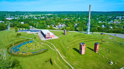 Wide view of Ariel Foundation Park destroyed glass factory and tree path trail aerial