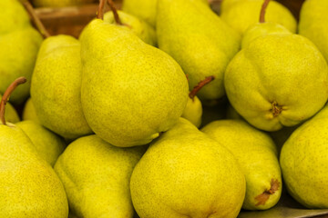 Showcase with pears. Food market. Background.