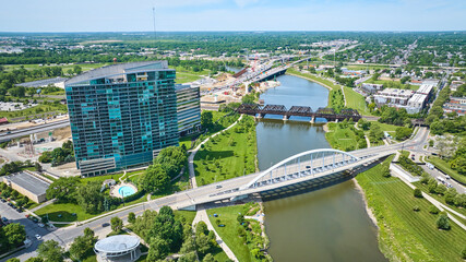 Outskirts of downtown Columbus Ohio with multiple bridges crossing Scioto River aerial