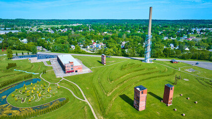 Aerial of abandoned freight elevators and tower near tree trail in Ariel Foundation Park