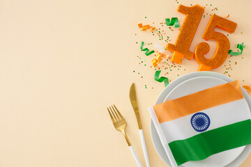 Happy India Independence Day idea. Top view arrangement of indian flag, shiny number 15, cutlery,...