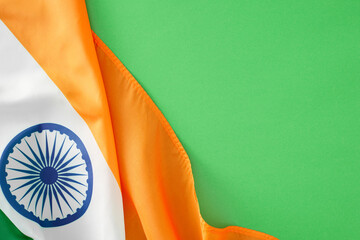Happy Independence Day of India concept. Top view photo of indian national flag on light green background with empty space for ads or message © Goncharuk film