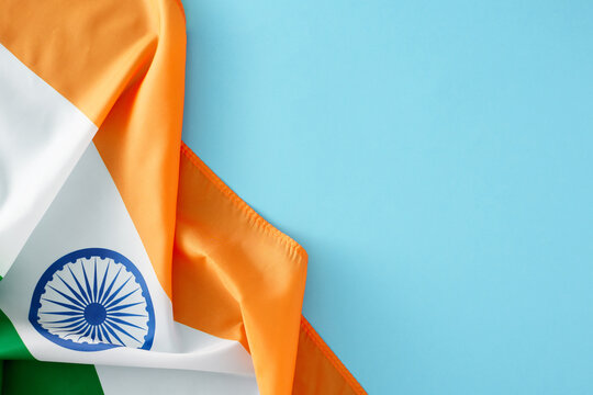 India Independence Day concept. Top view composition of indian national flag on light blue background with empty space for ads or text