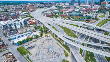 Massive highway system in Louisville KY aerial with skateboard park and baseball field - obrazy, fototapety, plakaty