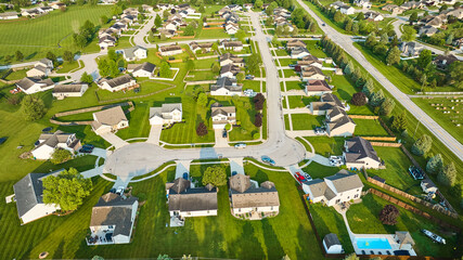 Neighborhood houses middleclass homes green lawns aerial