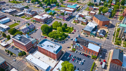 Aerial small town Mount Vernon with green park in center and parking lots