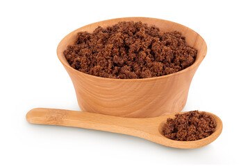 Dark muscovado sugar or Barbados sugar in wooden bowl isolated on white background
