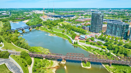 Aerial train bridge and walking bridge over water near Columbus Ohio