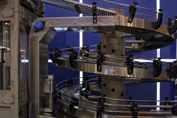 Big empty modern conveyor for sorting of goods. Industrial manufacturing. Factory constructions, technology, production line