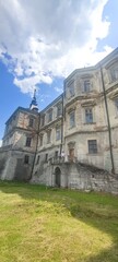 Fototapeta premium Old castle near Lviv. Podgoretsky castle. A man in front of an old castle. Castles of Ukraine