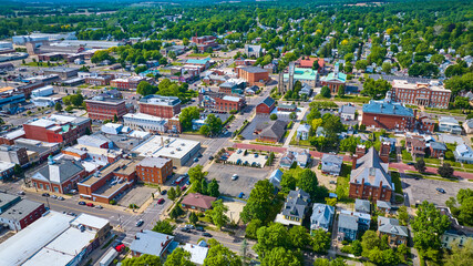 City with houses and industrial buildings and churches aerial