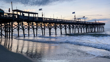 Pier with ocean waves in Myrtle Beach