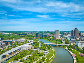 Aerial both sides of Scioto River in downtown Columbus Ohio with Center of Science and Industry