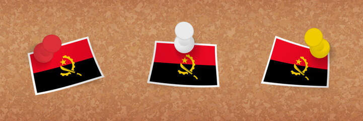 Angola flag pinned in cork board, three versions of Angola flag.