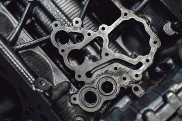 Overhaul of the motor for the car. Parts of an internal combustion engine. Cylinder block with...