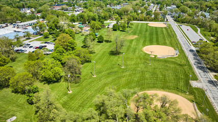 Park baseball kickball fields kids playground aerial mown fields with mower tracks neighborhoods