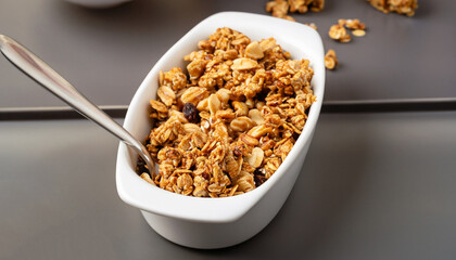 Peanut butter big cluster granola in white ramekin