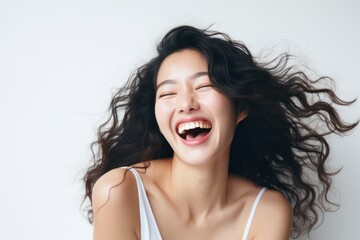 a professional portrait studio photo of a beautiful young asian woman model with perfect clean teeth laughing and smiling. isolated on white background. for ads and web design. Generative AI