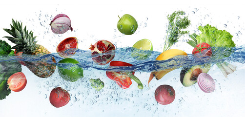 Many fruits and vegetables falling into water against white background