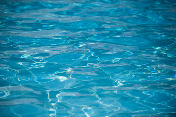 Water in swimming pool, background with high resolution. Wave abstract or rippled water texture.